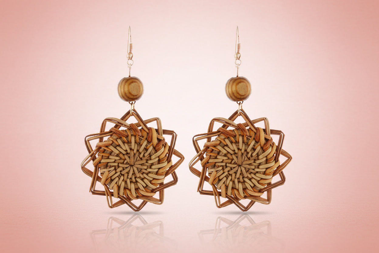 Pair of woven wooden earrings on a white background