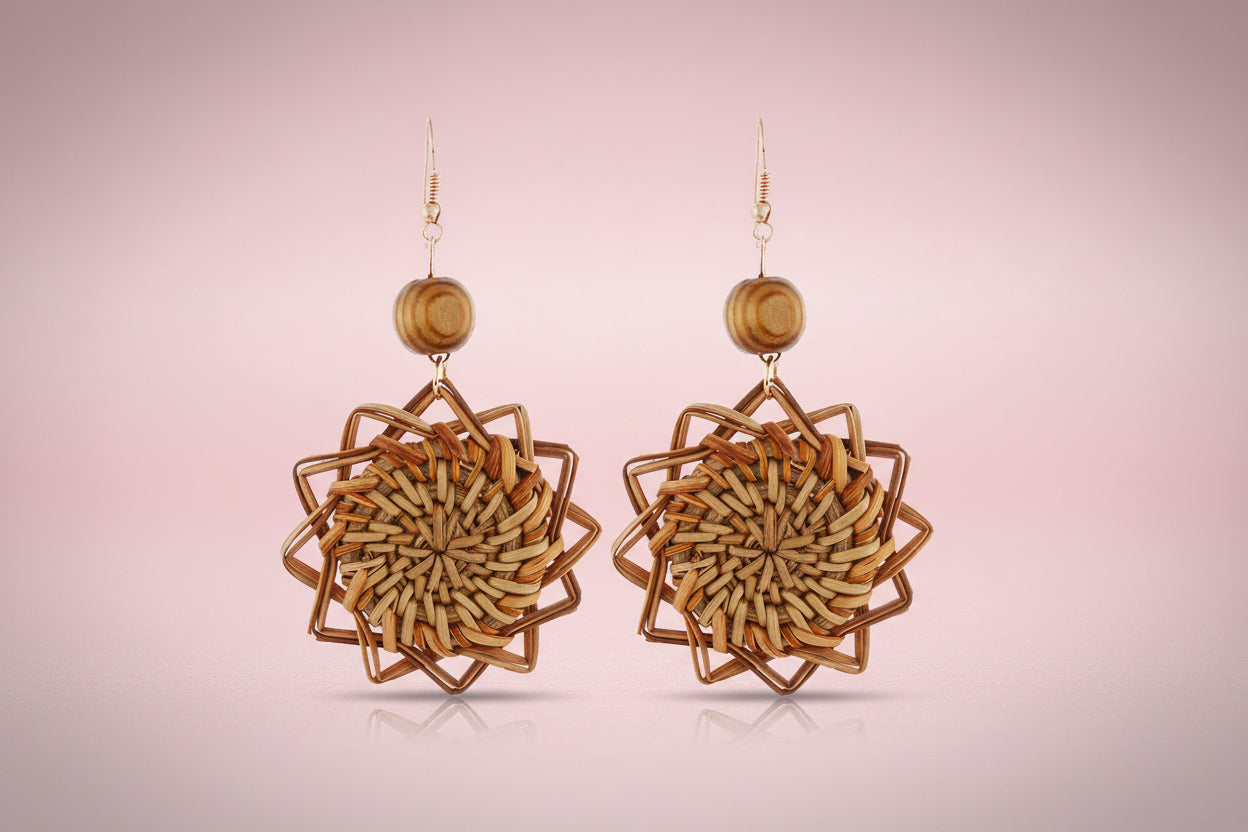 Pair of woven wooden earrings on a white background