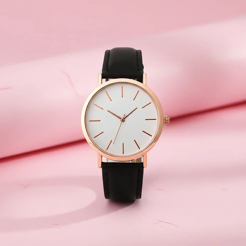 Wristwatch with black strap and rose gold case on white background