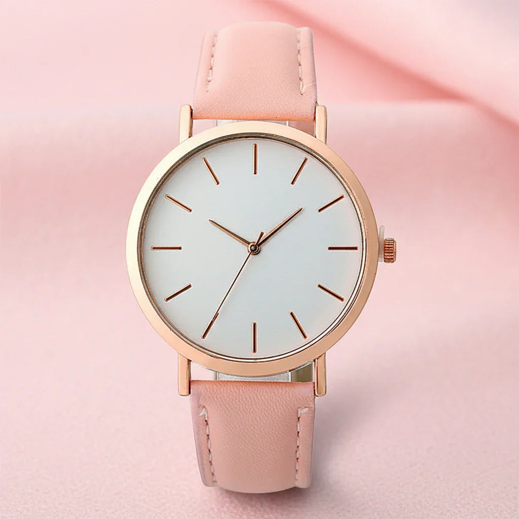 Wristwatch with pink strap and rose gold case on white background