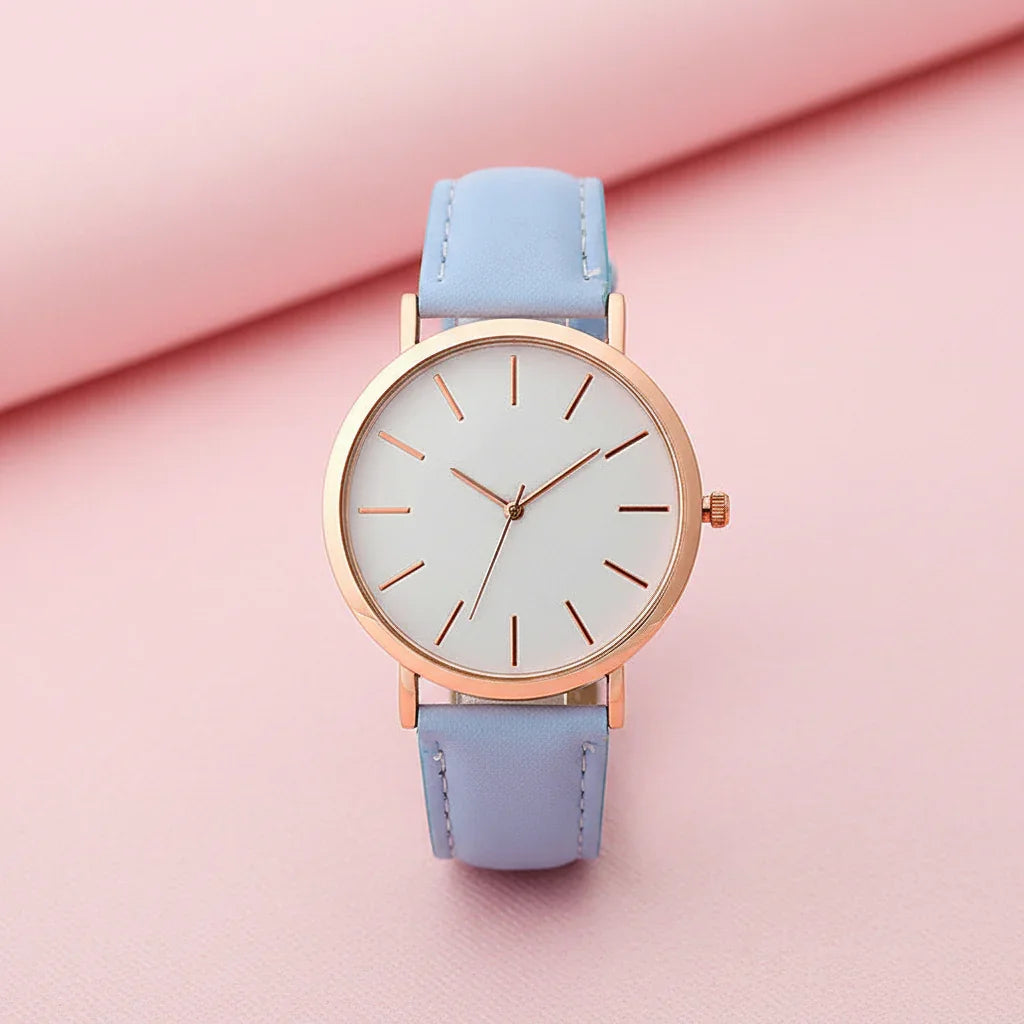 Wristwatch with light blue strap and rose gold case on white background