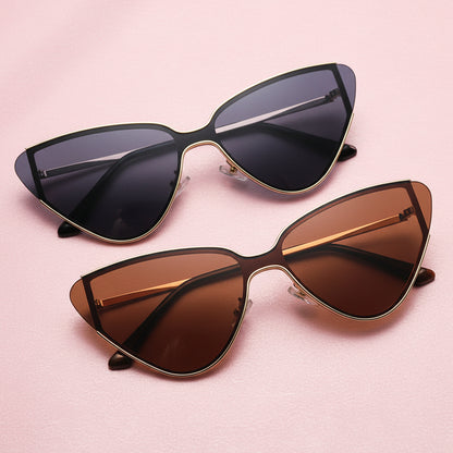 Two pairs of cat-eye sunglasses with different lens colors on a white background