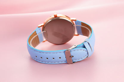 Wristwatch with a light blue leather strap on a white background