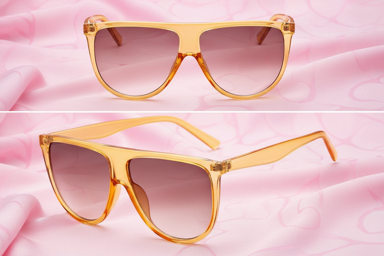 Pair of sunglasses with gold frame and gradient lenses on a white background