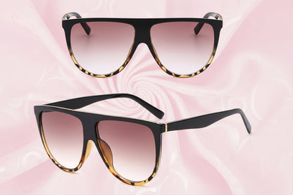 Black and tortoiseshell sunglasses with gradient lenses on a white background