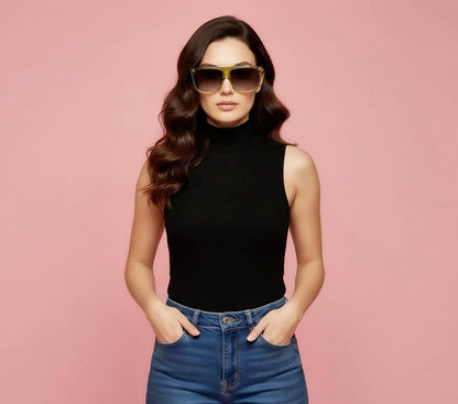 Woman wearing sunglasses and a black sleeveless top against a pink background