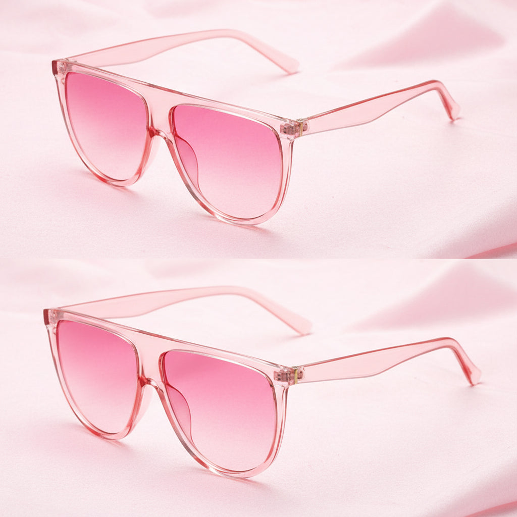 Pink sunglasses with clear frames on a white background