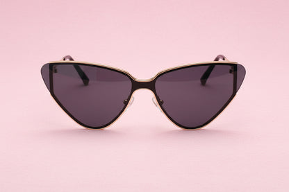 Cat-eye sunglasses with gold frame and dark lenses on a white background