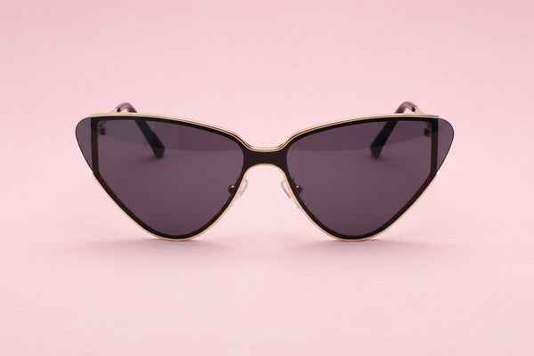 Cat-eye sunglasses with gold frame and dark lenses on a white background