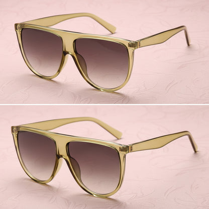 Gold-framed sunglasses with gradient lenses on a white background